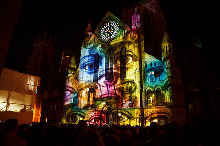 photo of multicolored concrete building at night thumbnail