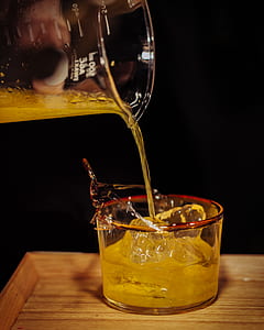person pouring shot glass thumbnail