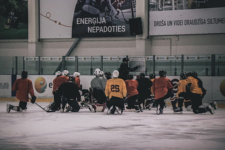 hockey player kneeling on hockey field thumbnail