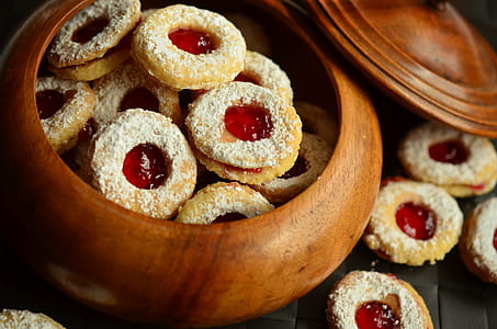 bowl of cookies topped with red fillings thumbnail