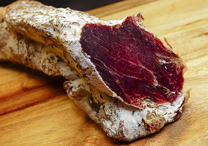 raw meat on brown wooden surface thumbnail