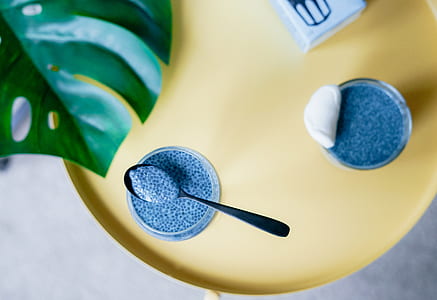 drinking glass and spoon on tabletop thumbnail