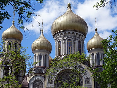 gray concrete building with domes during daytime thumbnail