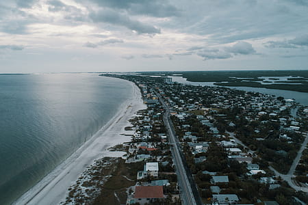 Aerial Photography of Houses Near Ocean thumbnail