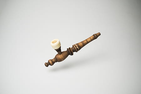 brown and white smoking pipe thumbnail
