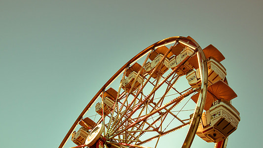 low angle photography of orange ferris wheel thumbnail