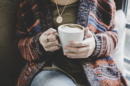 person holding mug thumbnail