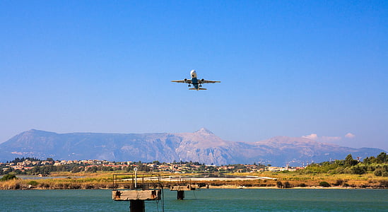 white airliner take flight during daytime thumbnail