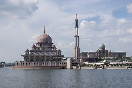 gray and brown dome building near body of water thumbnail