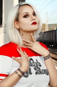 woman wearing white and red crew-neck shirt thumbnail