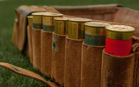seven bullets on brown leather bag thumbnail