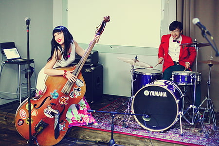 man and woman playing music instruments thumbnail