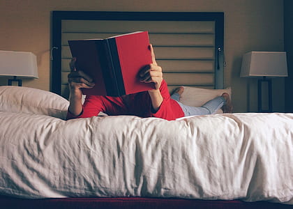 person reading white on bed thumbnail