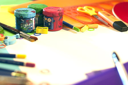 assorted colored paint bottles and art brush with scissors thumbnail