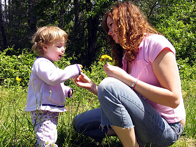 woman holding baby's purple jacket thumbnail