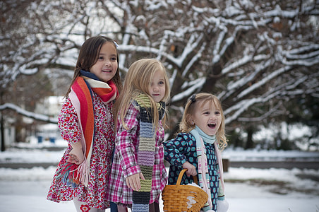 three girls standing near brown tree thumbnail