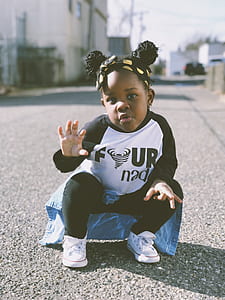 shallow focus photo of toddler thumbnail