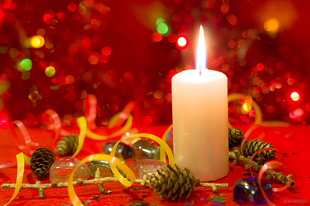 brown acorns beside white pillar candle thumbnail