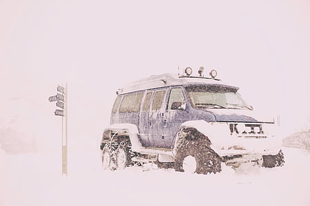 blue vehicle in snow covered gound thumbnail