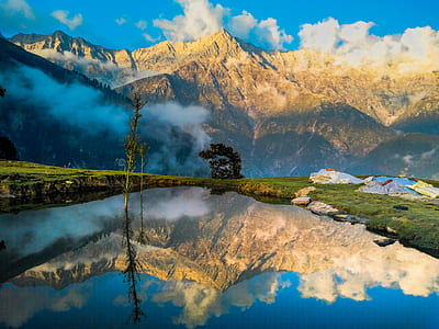 photography of mountain with body of water thumbnail