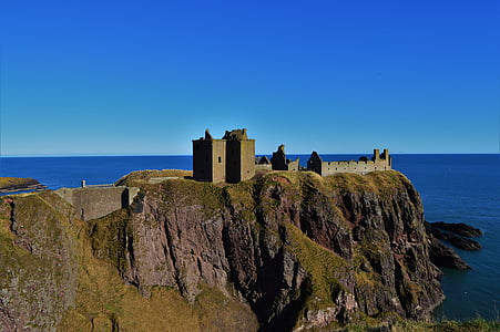 gray castle near seashore thumbnail