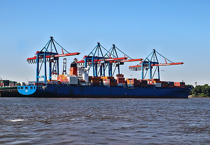 crane inside the cargo ship on body of water during daytime thumbnail