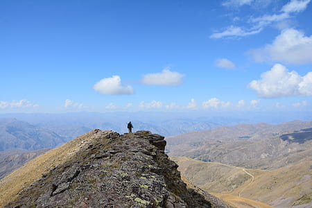 person standing on cliff thumbnail