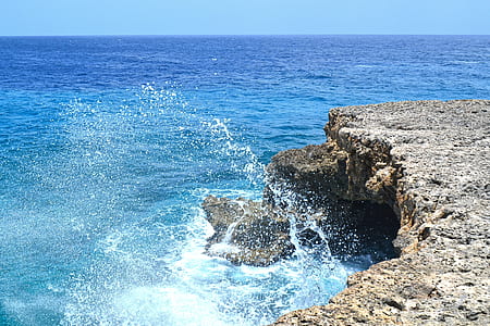 body wave of water near rock thumbnail