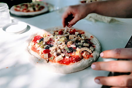 person holding baked strawberry pizza thumbnail