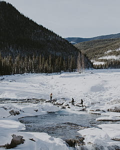 three people standing on snow thumbnail