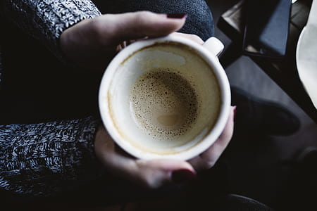 person holding mug using both hands thumbnail
