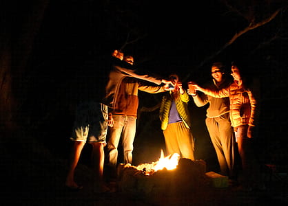 people cheering glass above bonfire thumbnail