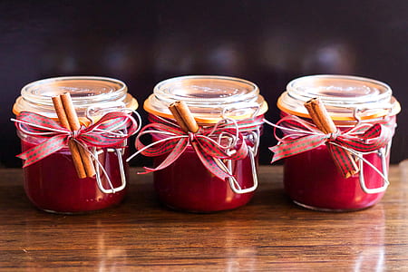 three red scented candles aligned thumbnail