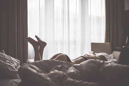 Sensual Woman in Lingerie Enjoying Her Time in Bed thumbnail