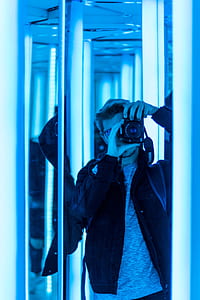man taking photo in front of mirror thumbnail