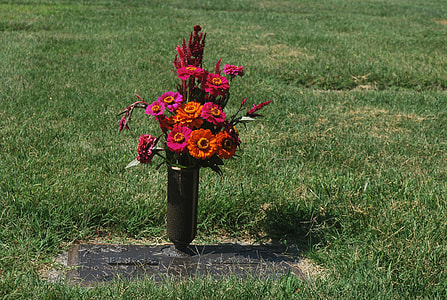flowers on vase on tombstone thumbnail