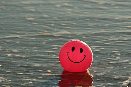 red emoji balloon in sea at daytime thumbnail