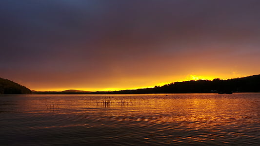 body of water during golden hour thumbnail