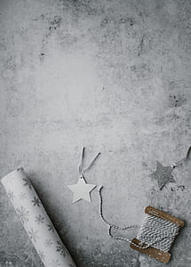 gray thread beside white paper star thumbnail