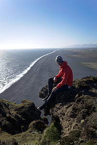 man sitting on cliff thumbnail