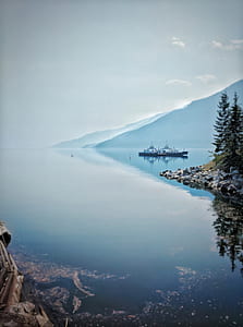 body of water with boats during daytime thumbnail