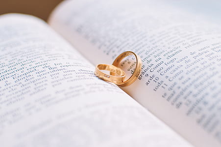 two gold-colored rings on book thumbnail