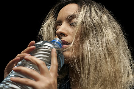 woman drinking bottled water thumbnail