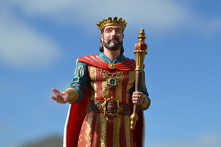 selective focus photo of man wearing crown figurine thumbnail
