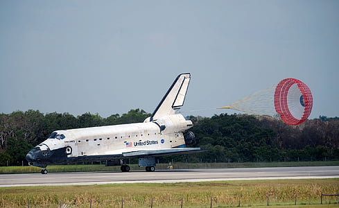 white airplane on ground thumbnail