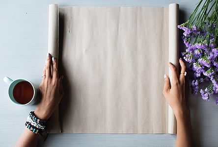 person holding brown pad thumbnail