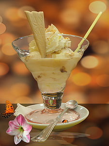 clear footed glass filled with yellow ice cream on saucer thumbnail