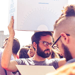man carrying white box thumbnail