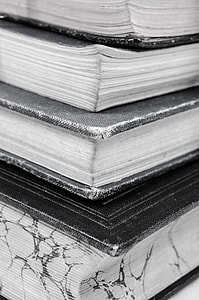 four close-up photo of hardbound books thumbnail