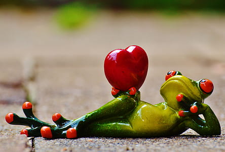 green and yellow ceramic frog figurine thumbnail